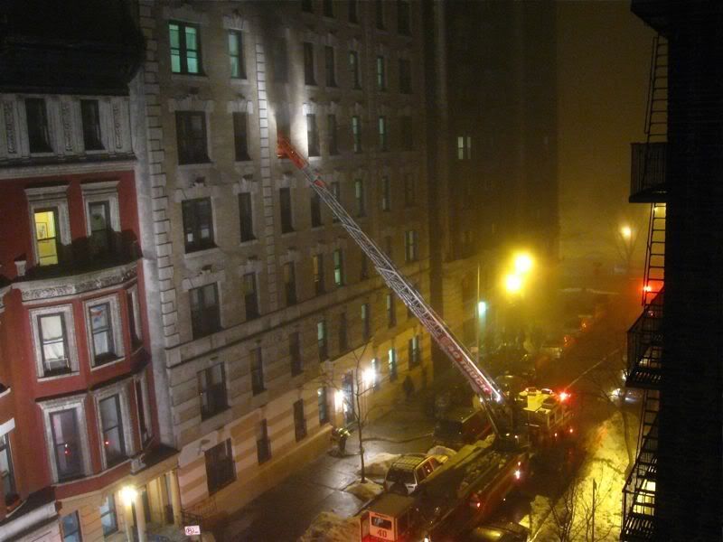 Hook and ladder fire truck outside a fire on 109 St, NYC, Jan 2, 2011